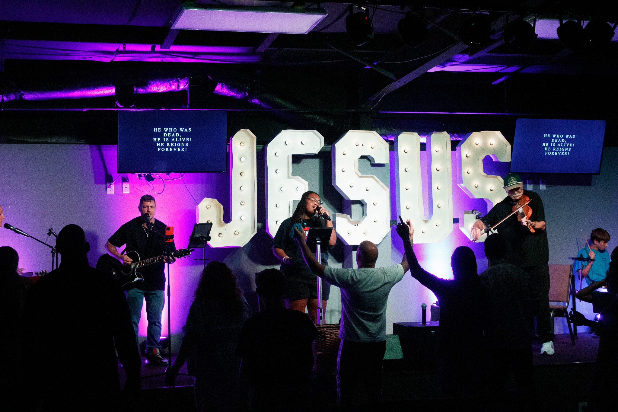 Worship band on stage at N-Vizion Church
